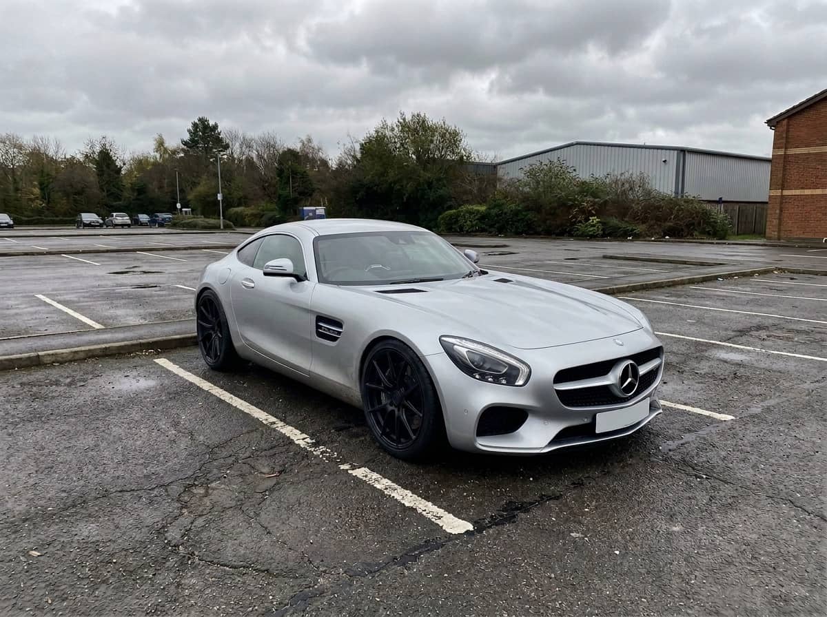 The same coupe previewed with matte black forged wheels and a lowered stance